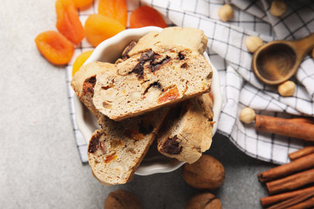 Bowl with delicious biscotti cookies on grunge background, closeupの写真素材