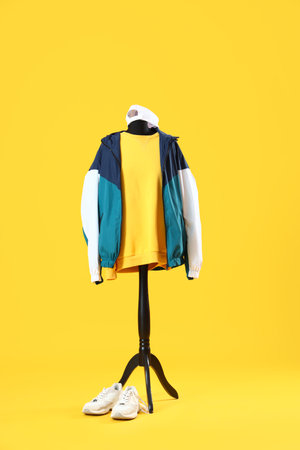 Mannequin with sportswear on yellow backgroundの写真素材
