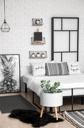 Interior of modern stylish bedroom with shelvesの写真素材