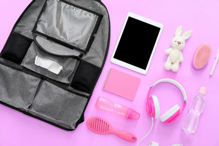 Car seat organizer with different things on color background