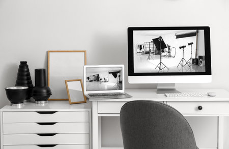 Workplace of photographer in modern photo studioの写真素材