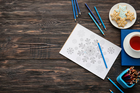 Composition with coloring picture on tableの写真素材