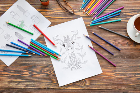 Coloring pictures and pencils on tableの写真素材