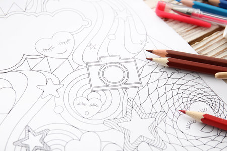 Coloring picture and pencils on tableの写真素材
