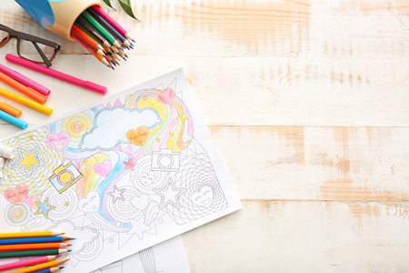 Coloring picture and pencils on tableの写真素材