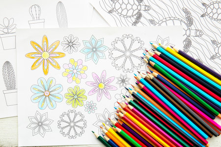 Coloring pictures and pencils on tableの写真素材