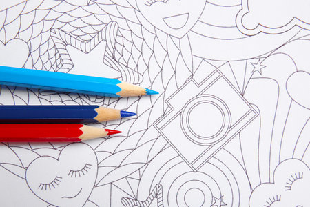 Coloring picture and pencils on tableの写真素材