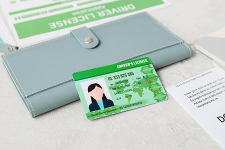 Driving license with wallet on tableの写真素材
