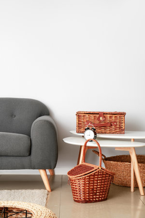 Sofa, table and wicker baskets in roomの写真素材