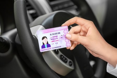 woman driving license in car salonの写真素材