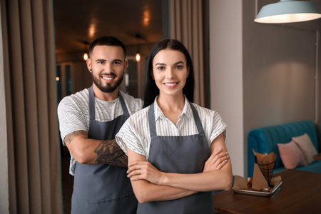 Portrait of young waiters in a restaurantの写真素材
