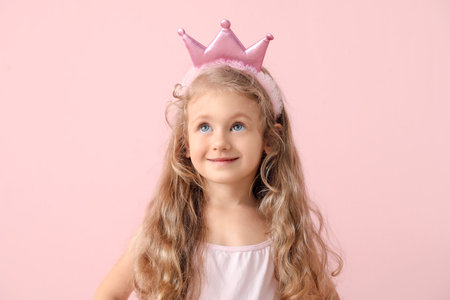 Cute little princess on color backgroundの写真素材