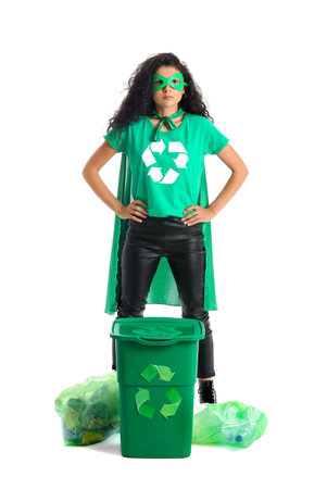 Woman dressed as eco superhero with trash on white backgroundの写真素材
