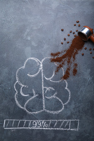 Creative composition with coffee and drawn human brains on dark backgroundの写真素材
