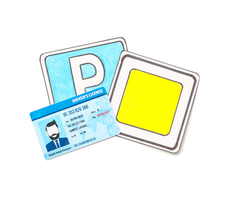 Driving license with road signs on white backgroundの写真素材