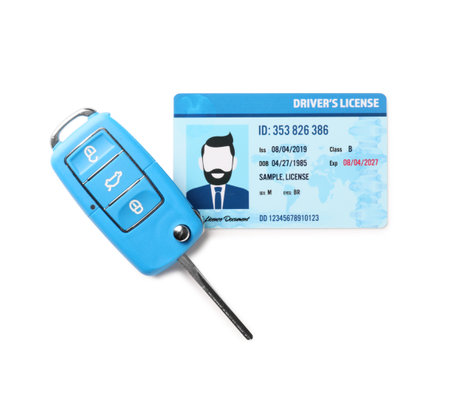 Driving license with car key on white backgroundの写真素材