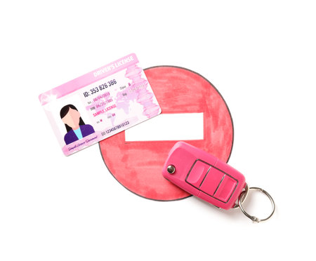 Driving license with car key and road sign on white backgroundの写真素材
