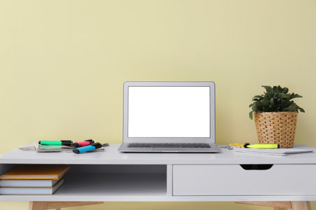 Modern laptop with blank screen on tableの写真素材