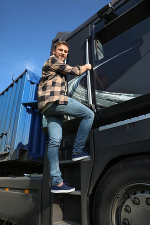 Male driver near big truck outdoorsの写真素材