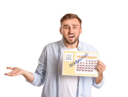 Troubled man holding calendar with written word QUARANTINE against white backgroundの写真素材