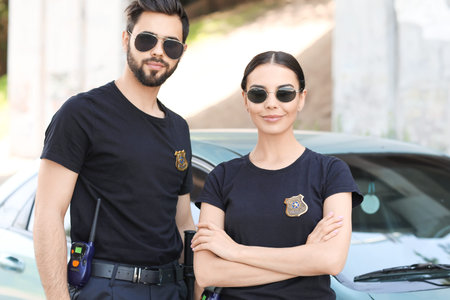 Police officers near car outdoors