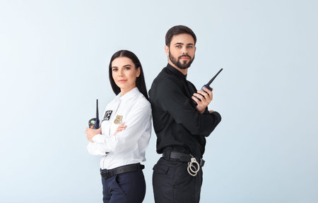 Police officers on light background