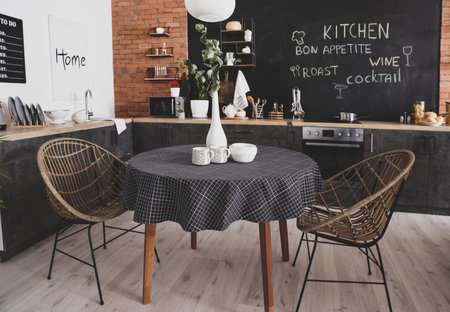 Interior of stylish modern kitchen with dining tableの写真素材
