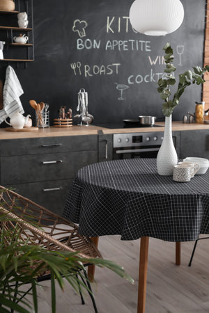 Interior of stylish modern kitchen with dining table