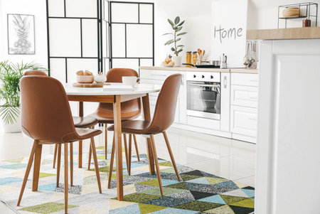 Interior of stylish modern kitchen with dining tableの写真素材