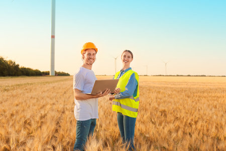 Engineers on windmill farm for electric power productionの写真素材