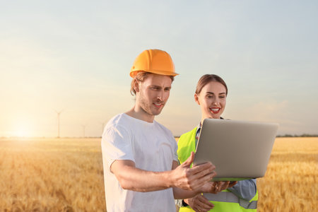 Engineers on windmill farm for electric power productionの写真素材