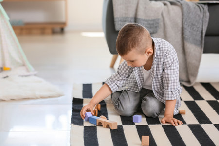 Cute little boy playing at homeの写真素材