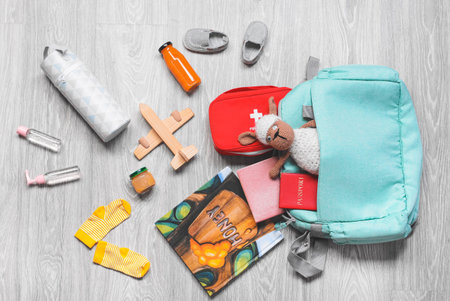 Travel accessories for children on wooden backgroundの写真素材