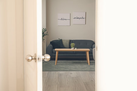View of living room through open doorの写真素材
