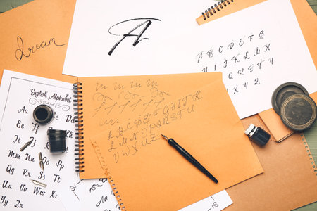 Composition with notebook, nib pen and inkの写真素材