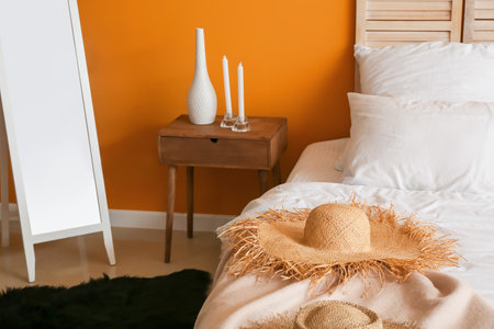 Stylish interior of modern bedroom with mirror and bedside tableの写真素材