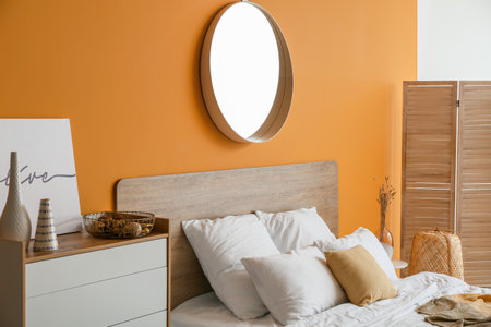 Stylish interior of modern bedroom with mirrorの写真素材