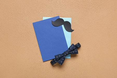 Blank cards with paper mustache and bow on beige background. father's day celebrationの写真素材
