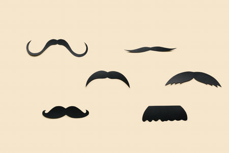 Paper mustaches on beige background. father's day celebrationの写真素材