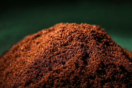 Heap of coffee powder on green background, closeupの写真素材
