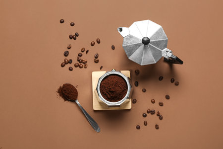 Coffee maker with powder and beans on brown backgroundの写真素材