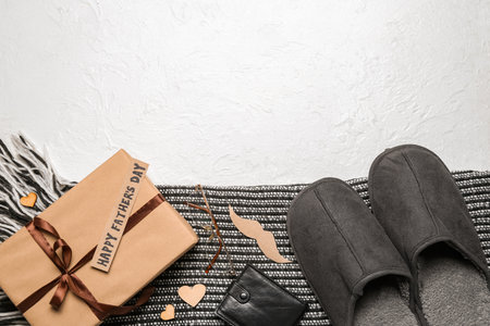 Composition with male accessories and gift for Father's Day celebration on light background, closeupの写真素材