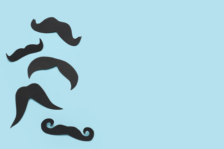 Set of paper mustaches on color backgroundの写真素材