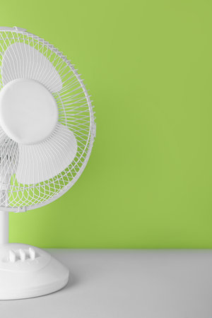 electric fan on green backgroundの写真素材