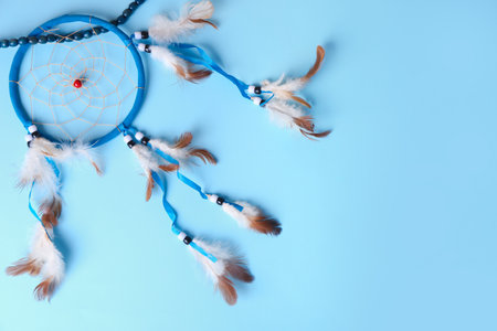 beautiful dream catcher on blue backgroundの写真素材