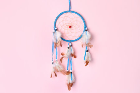 Beautiful dreamcatcher on pink backgroundの写真素材
