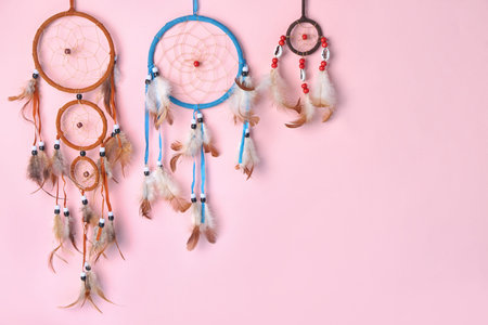 Beautiful dreamcatchers on pink backgroundの写真素材