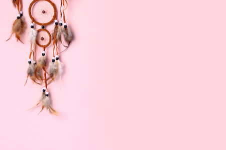 Beautiful dreamcatcher on pink backgroundの写真素材