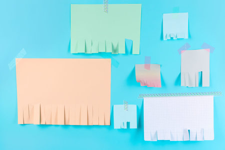 Blank paper tear-off ads on blue background