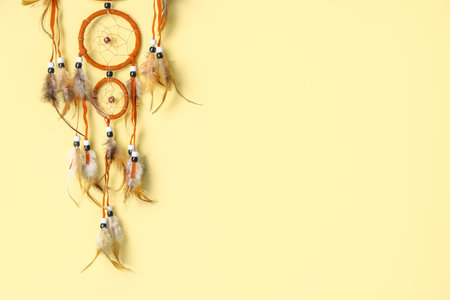 Beautiful dreamcatcher on beige backgroundの写真素材